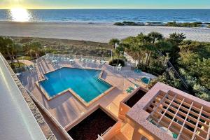 an overhead view of a swimming pool and the beach at Crescent Beach Club II 5B in Clearwater Beach