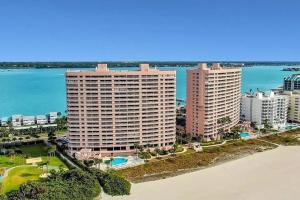 an aerial view of two tall buildings on the beach at Crescent Beach Club II 5B in Clearwater Beach