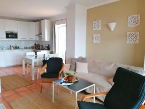 a living room with a couch and a table at Sweden Apartment - Top Floor one bedroom with sea views - RS in Lagos