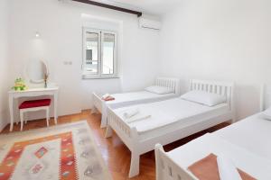 Postel nebo postele na pokoji v ubytování Apartments Smoky