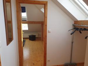a hallway leading into a room with a attic at Hotel, Ferienwohnung, Zimmer in Bad Driburg