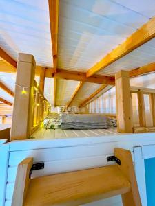 a bed in a house under a ceiling at Bi Datça in Datca +10 photos