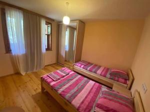 Postel nebo postele na pokoji v ubytování guesthouse MUKHA