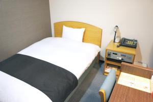 Postel nebo postele na pokoji v ubytování Hotel Abest Kochi
