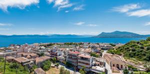 an aerial view of a city and a body of water at Panoramic view!Penthouse 120qm of sea & mountain in Loutra Edipsou