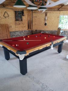 a red pool table in a room with at Estancia Don Domingo in Curicó