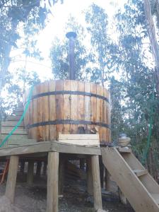 a large wooden barrel sitting on top of a wooden table at Estancia Don Domingo in Curicó