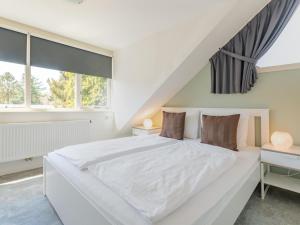 Postel nebo postele na pokoji v ubytování Tiny house Pimpelmees + 30 fotografií