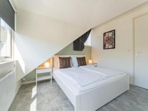 Postel nebo postele na pokoji v ubytování Tiny house Pimpelmees