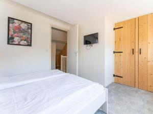 Postel nebo postele na pokoji v ubytování Tiny house Pimpelmees