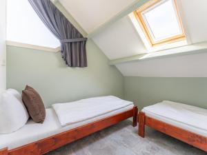 Postel nebo postele na pokoji v ubytování Tiny house Pimpelmees