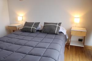מיטה או מיטות בחדר ב-Origen Rent a house
