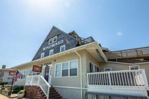 a home with a sign on the front of it at Windward at the Beach in Beach Haven