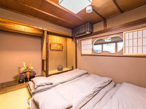 Voodi või voodid majutusasutuse 慶有魚·一心·鸭川(Kyotofish·Kamogawa)*鸭川畔独栋地暖百年町屋*京都仅十套 toas