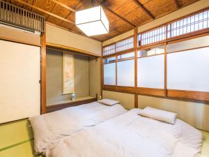 Voodi või voodid majutusasutuse 慶有魚·一心·鸭川(Kyotofish·Kamogawa)*鸭川畔独栋地暖百年町屋*京都仅十套 toas