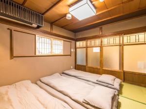 Voodi või voodid majutusasutuse 慶有魚·一心·鸭川(Kyotofish·Kamogawa)*鸭川畔独栋地暖百年町屋*京都仅十套 toas