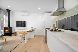 a kitchen with a counter and a stove top oven at The Love Shack - romantic bungalow in Blairgowrie