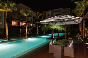 Bazén v ubytování Luxury new apartment in Cap Cana Punta Cana nebo v jeho okolí