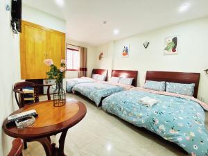 Postel nebo postele na pokoji v ubytování Hệ thống MylaHome - Chi nhánh Ks Kim Châu