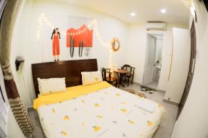 Postel nebo postele na pokoji v ubytování Hệ thống MylaHome - Chi nhánh Ks Kim Châu