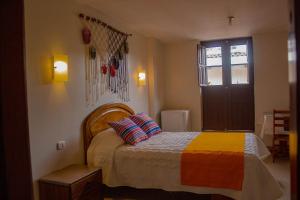 Un ou plusieurs lits dans un hébergement de l'établissement Hostal Hatunkay Cajamarca