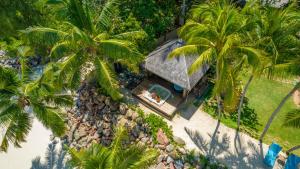 an overhead view of a house with palm trees at Villa Sofia in Anse Kerlan
