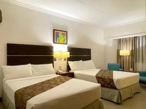 Postel nebo postele na pokoji v ubytování Days Hotel by Wyndham Iloilo