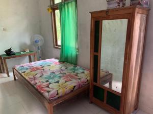 Кровать или кровати в номере Homestay Jemiran