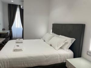 Postel nebo postele na pokoji v ubytování AngelicaHome Roma