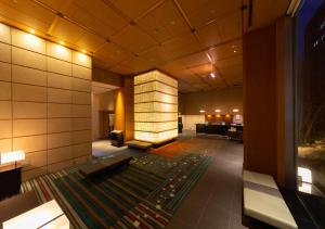 a lobby of a hotel with a large rug at Hotel Niwa Tokyo in Tokyo