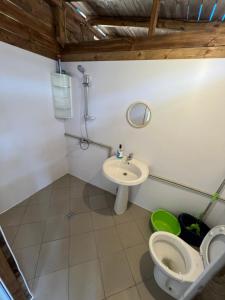 a bathroom with a toilet and a sink at Каравана Чайка in Sozopol