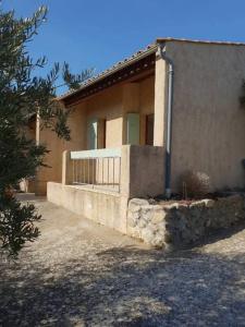 a house with a fence in front of it at Résidence Lou Cigaloun - ANA LOCATION in Gréoux-les-Bains