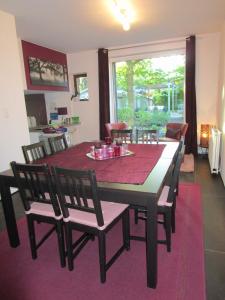 a dining room table and chairs in a room at Le Relais des Fagnes in Sart-lez-Spa