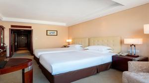 Cama o camas de una habitación en Maison New Century Hotel Ningbo