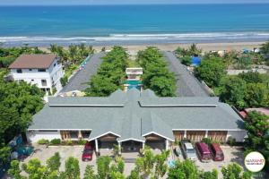 an aerial view of a house next to the beach at Marand Beach Resort in Bauang