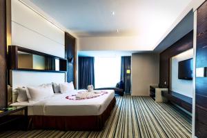 Postel nebo postele na pokoji v ubytování Ixora Hotel Penang