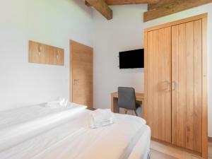 Posteľ alebo postele v izbe v ubytovaní Chalet in Niedernsill near Ski Slopes