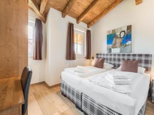 Posteľ alebo postele v izbe v ubytovaní Chalet in Niedernsill near Ski Slopes