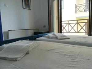 Postel nebo postele na pokoji v ubytování Melina Apartments - Cozy Holiday Apartment in Nikiti