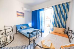Posteľ alebo postele v izbe v ubytovaní Jaana & Akis Holiday Home 1&2, Haraki + 23 fotografií