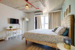 Postel nebo postele na pokoji v ubytování Sliema Creek Suites