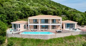 an aerial view of a house with a swimming pool at Villa Thilia in Meganisi