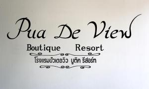 a sign with the words puerto be virgin bathroom resort at Pua De View Boutique Resort in Pua