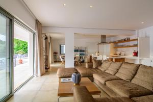 a living room with a couch and a table at Villa Thilia in Meganisi