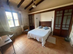 A bed or beds in a room at Agroturismo Finca Dalt Murada
