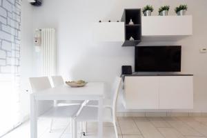 A television and/or entertainment centre at GetTheKey Pasubio Apartment