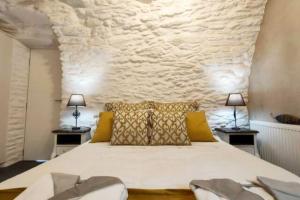 Postel nebo postele na pokoji v ubytování Amarienitas Suites