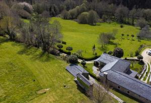 an aerial view of a house in a field at Casa Rural Graña da Acea in Monfero