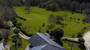 an aerial view of a house in a park at Casa Rural Graña da Acea in Monfero