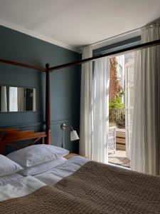 A bed or beds in a room at SOFS boutique hotel